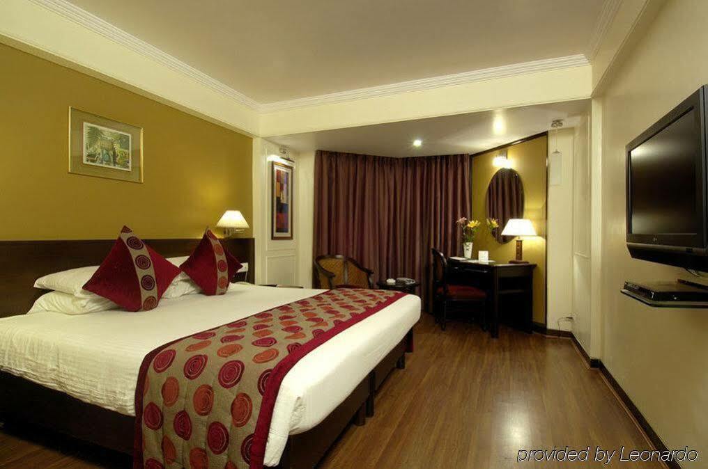 Ramee Guestline Hotel Juhu Мумбаї Номер фото